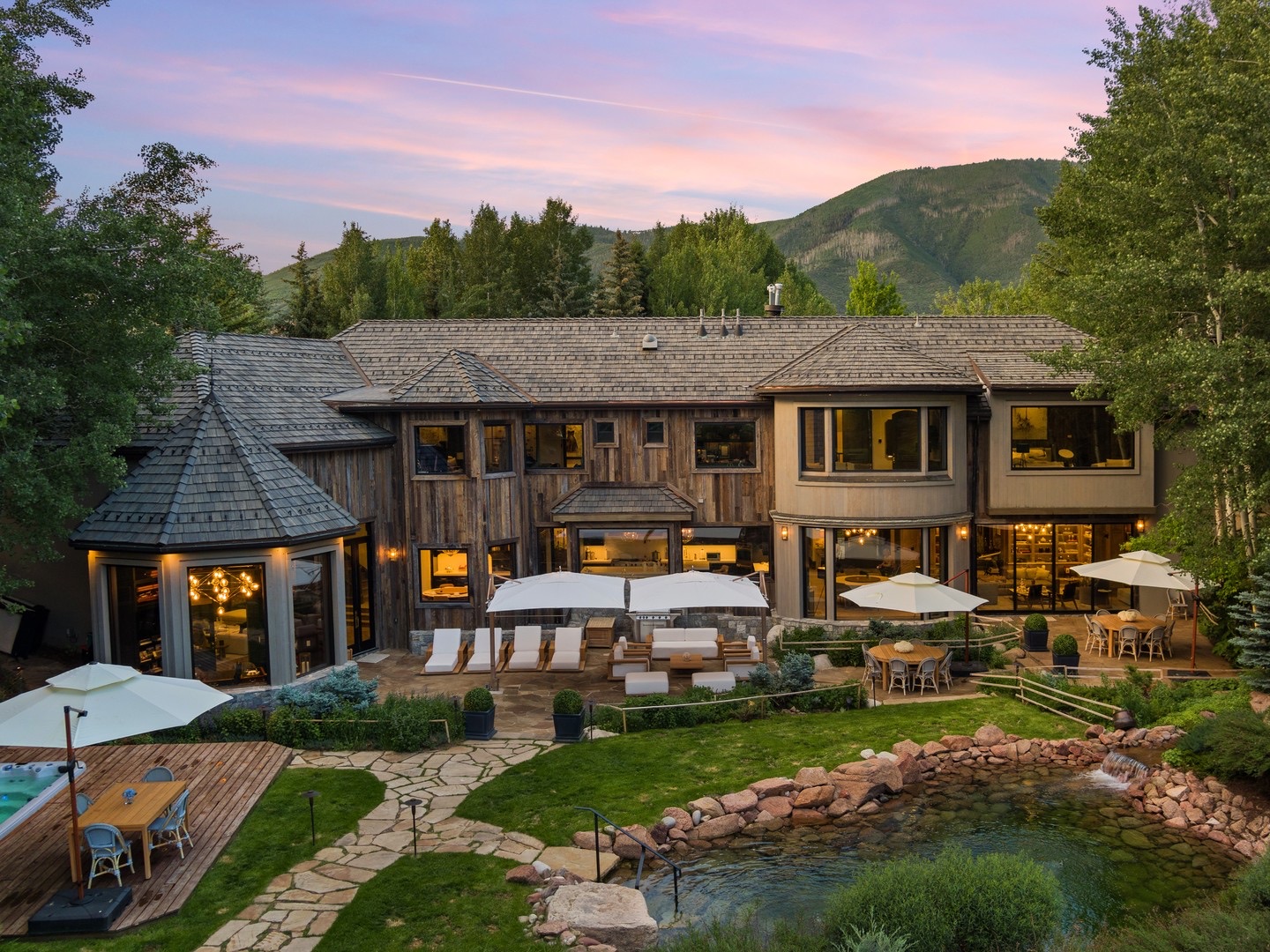 Mountain estate at dusk with a Brava composite shake roof