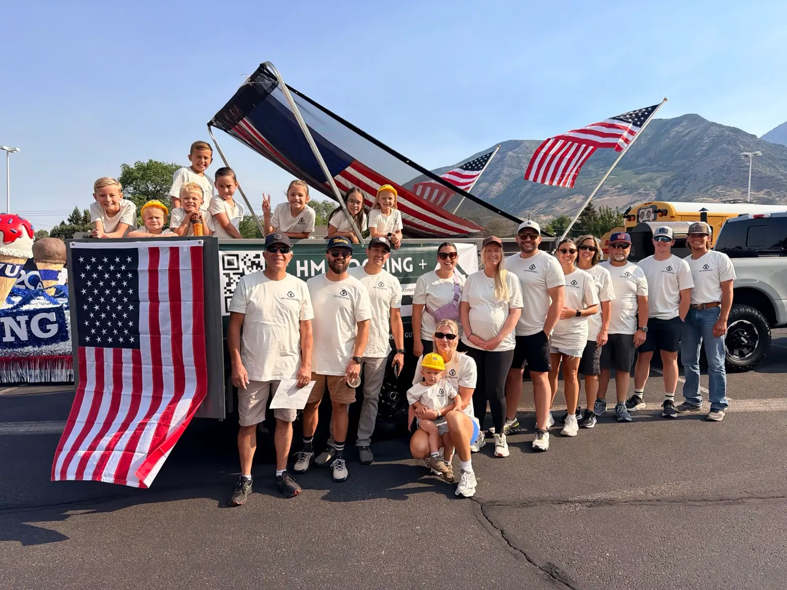 The HM Roofing team and their families at the Pleasant Grove Strawberry Days parade