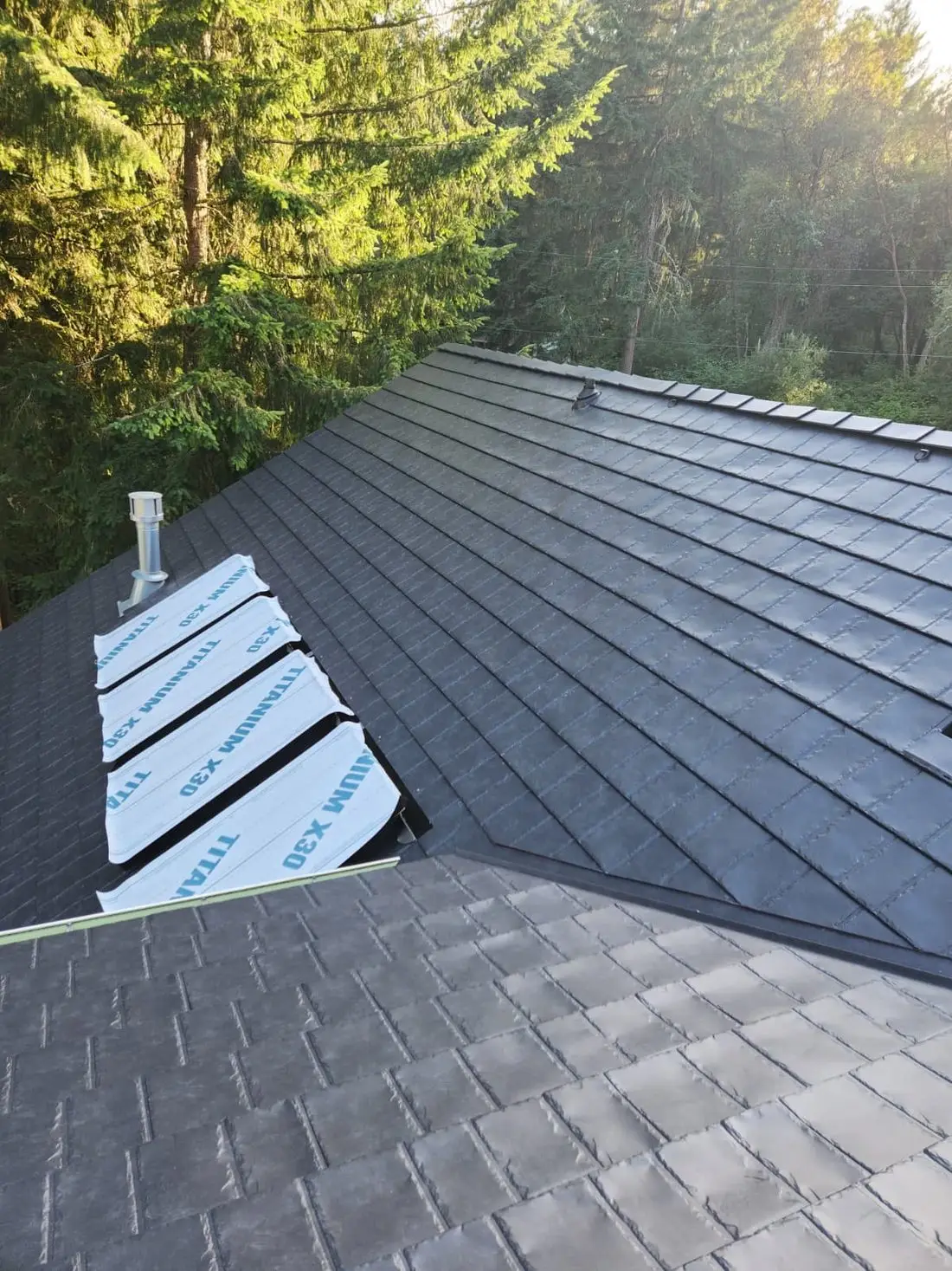 HM Roofing crew installing a ProVia metal roof over Titanium underlayment